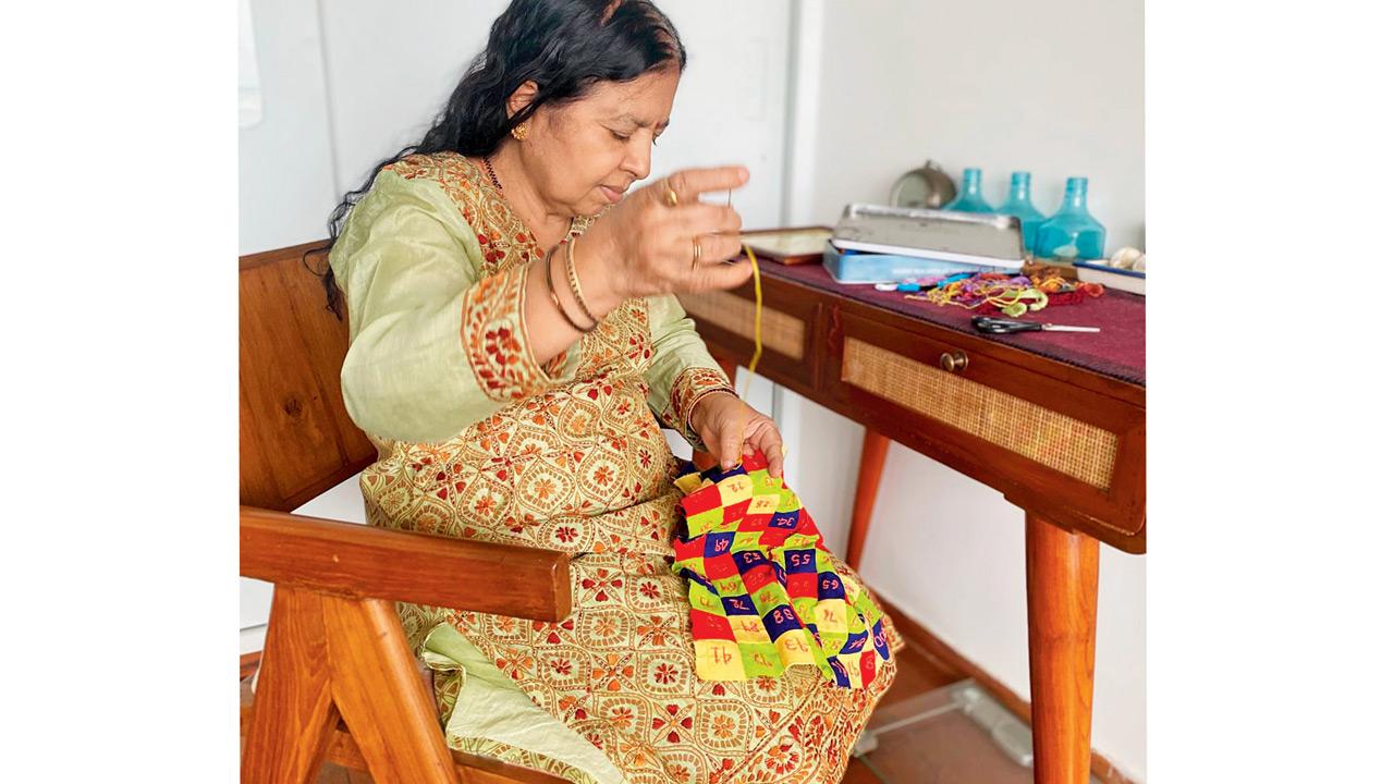 Nirmala Hegde works on a new stitch back at home in Malad