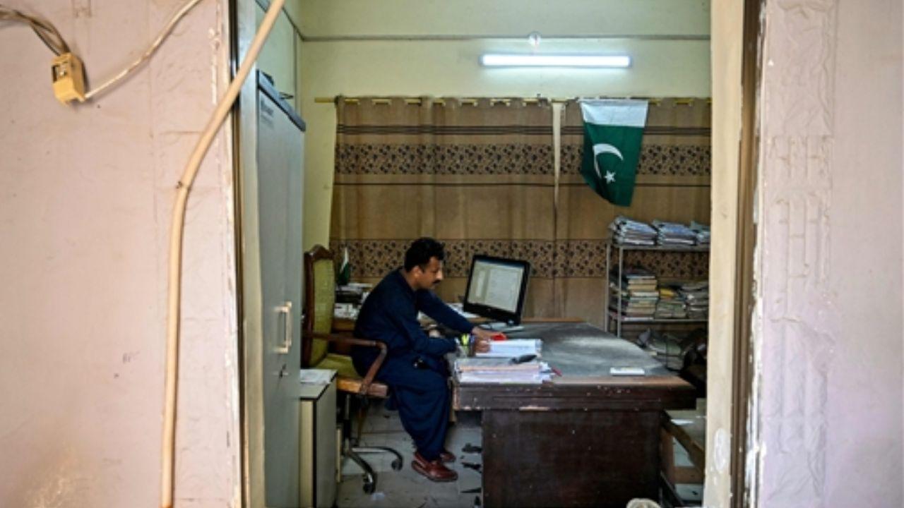 A prison official was seen working inside his damaged office at a jail facility in Karachi’s Malir district after a low-intensity earthqauke hit the office