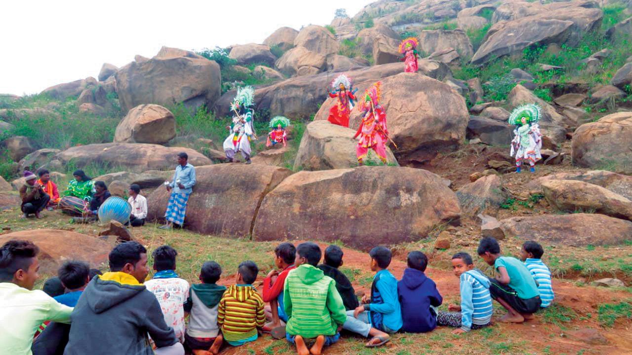 Villagers watch a Chhau performance