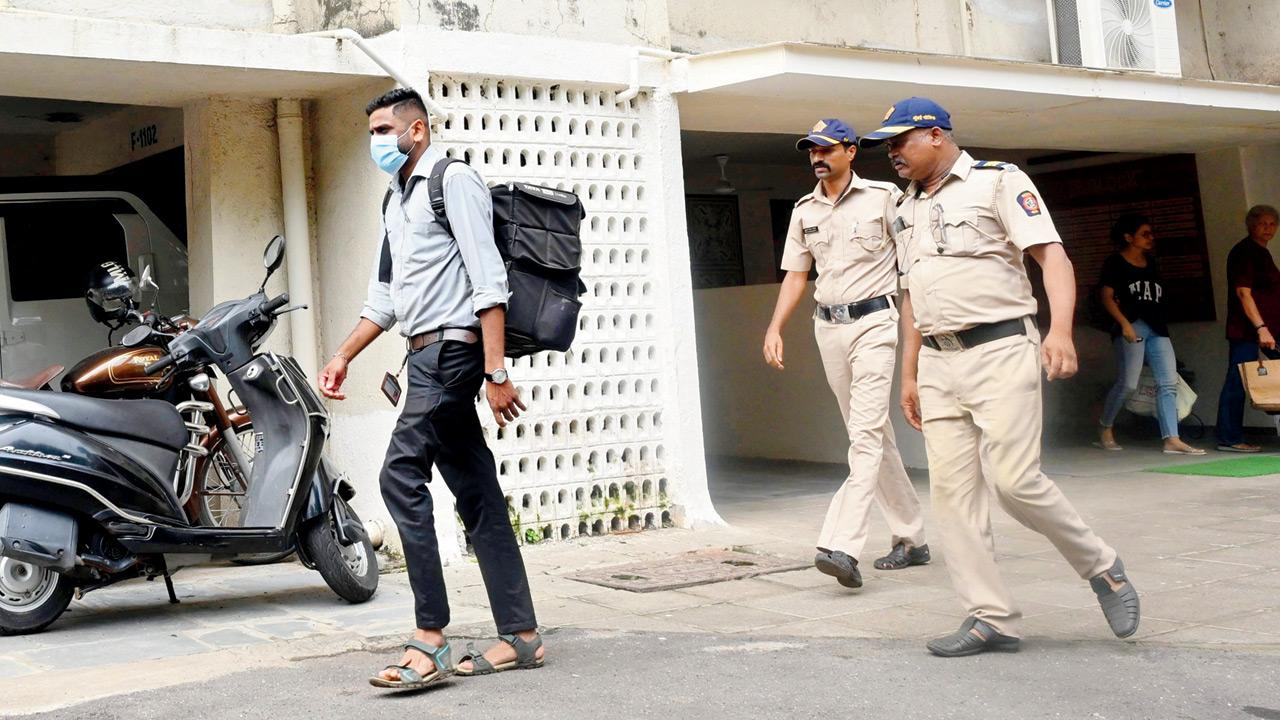 An individual from a private laboratory leaves the premises after collecting DNA samples from Capt Sabharwal’s kin. Pic/Satej Shinde
