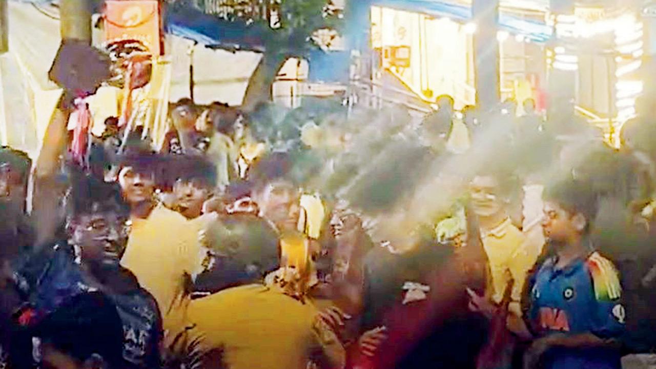Constable (in helmet) arrives at the celebration site in Kandivli following complaints of road blockage