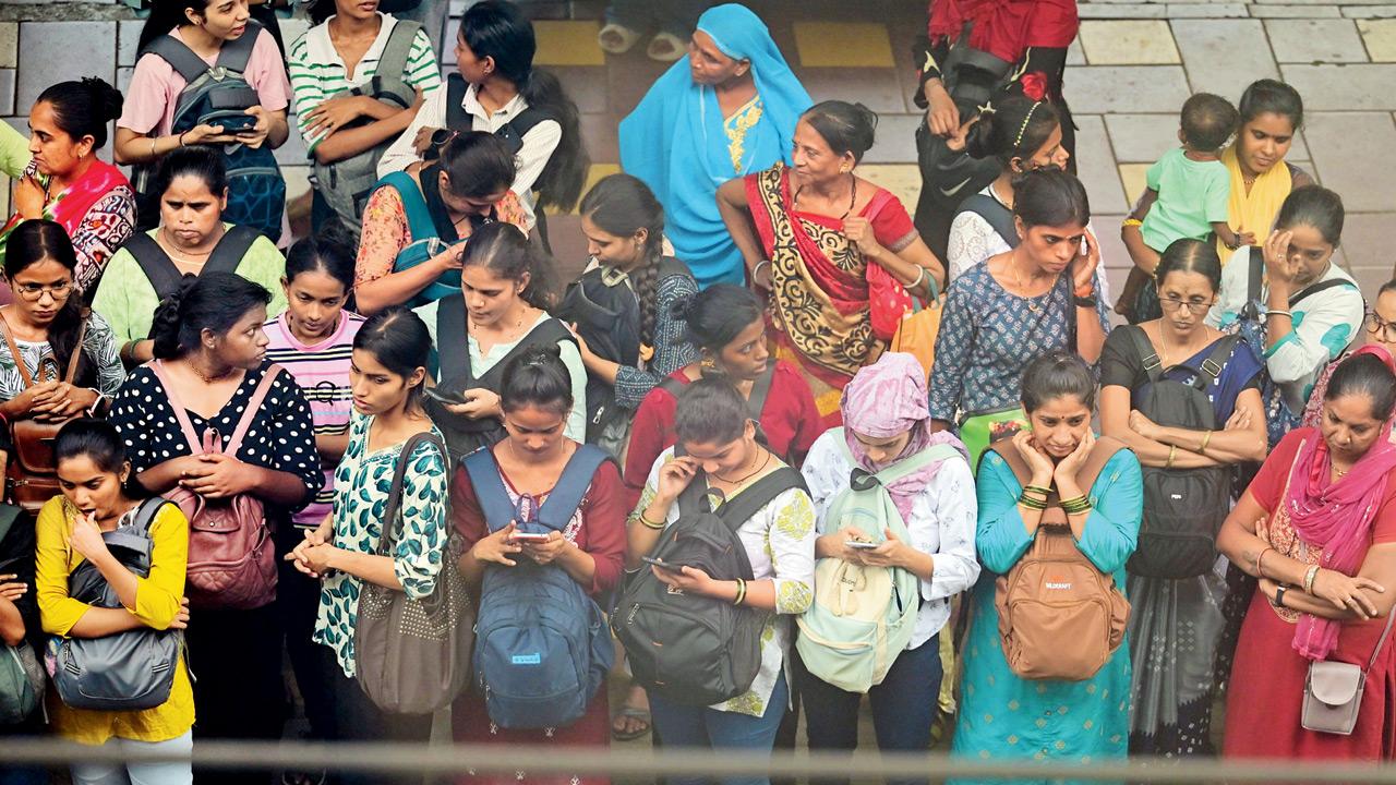 Commuters wait for the train at Borivli station yesterday