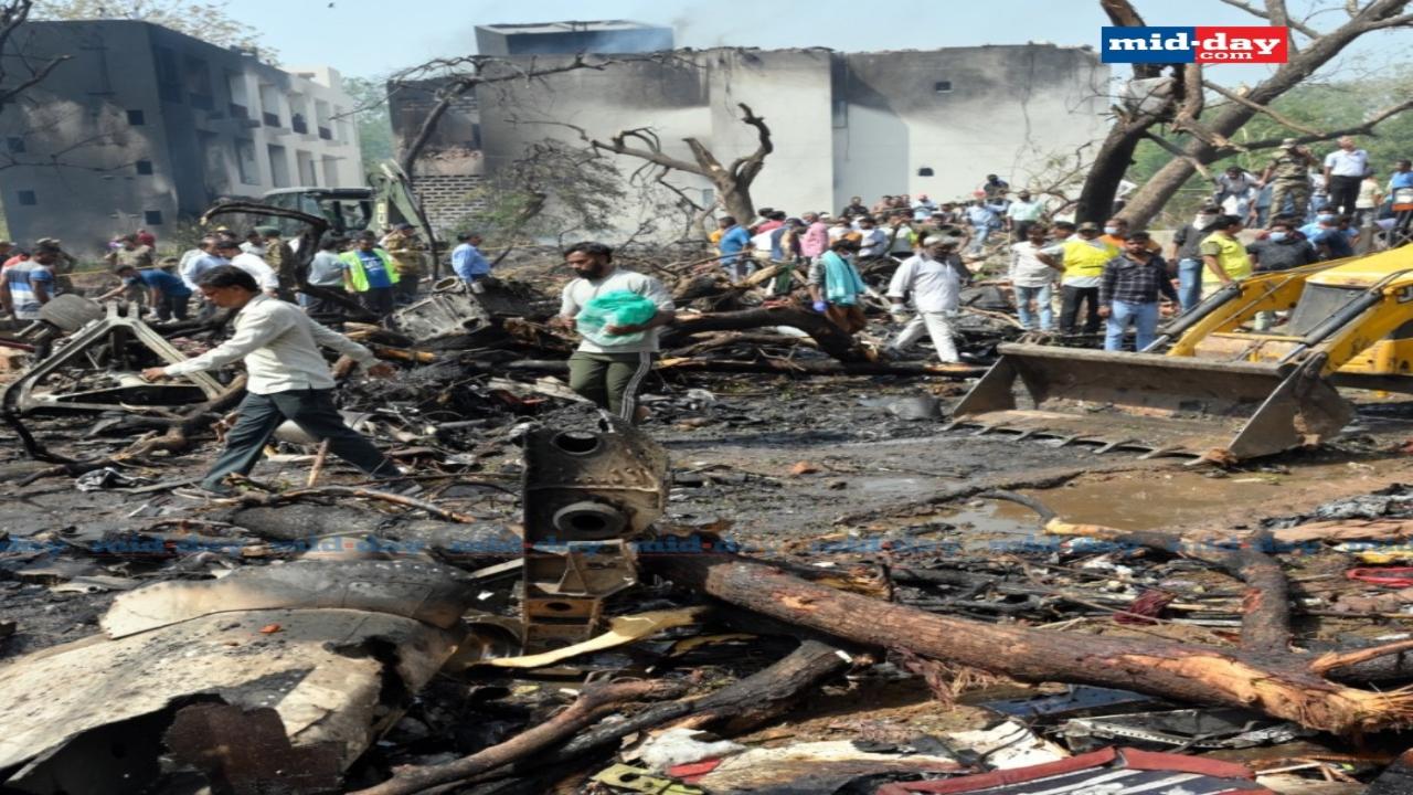 Debris scattered across the crash site as firefighters and rescue teams conduct their search 