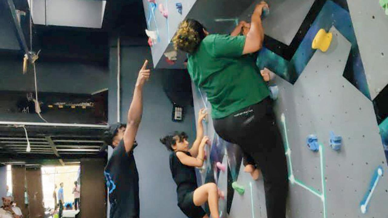 Participants scale the walls during a session