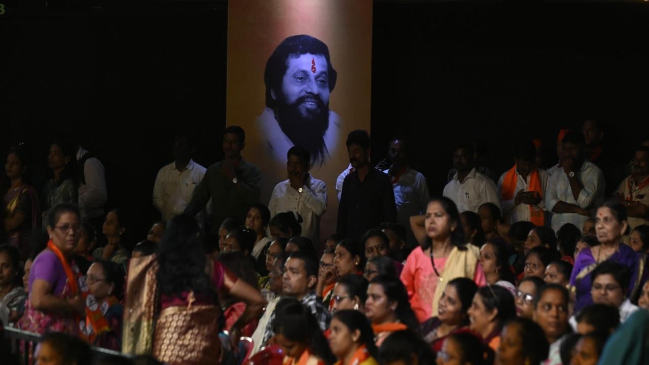 An image of Shinde's late mentor Anand Dighe is displayed on a screen at the event