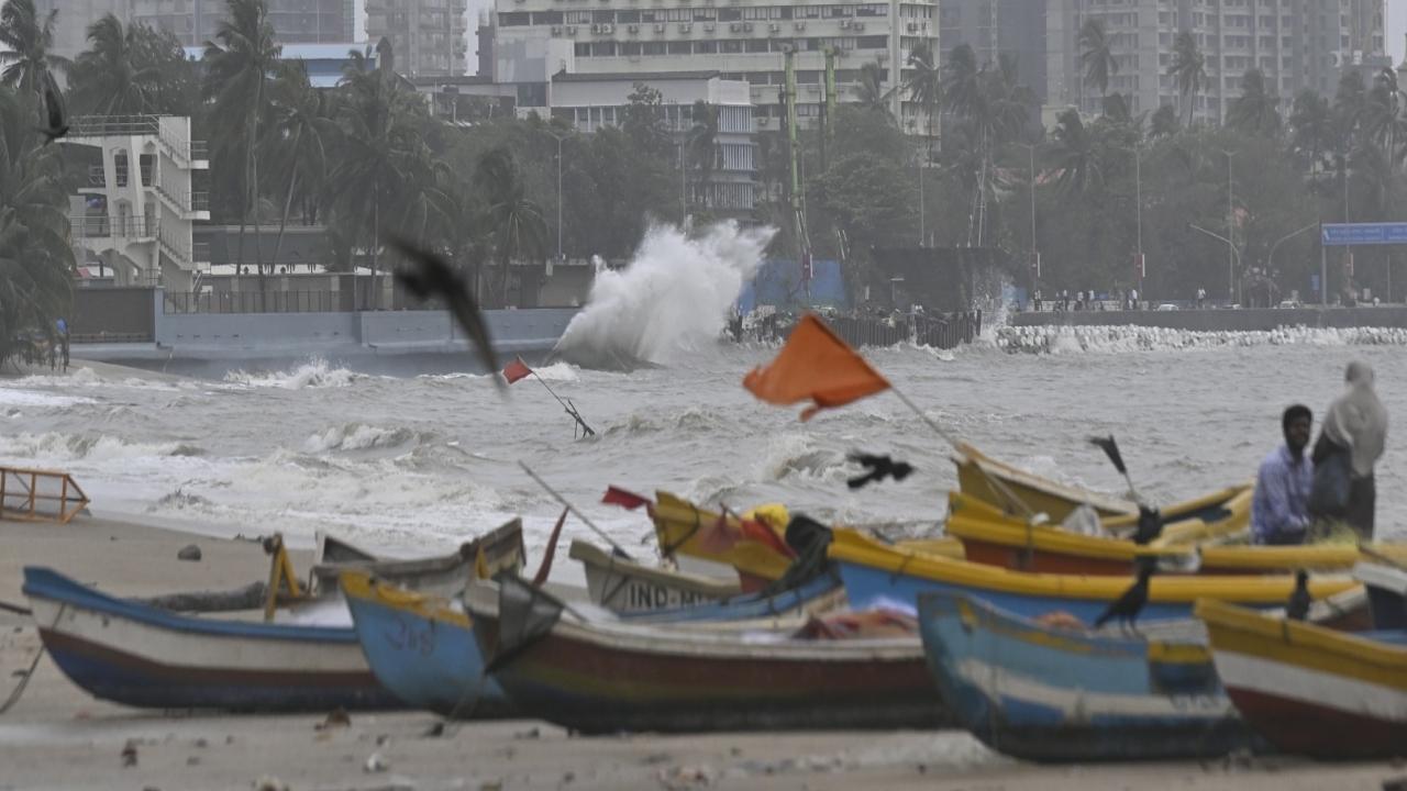 Waves crash against the Mafatlal Bath wall during high tide and rough sea conditions, as seen from Girgaum 