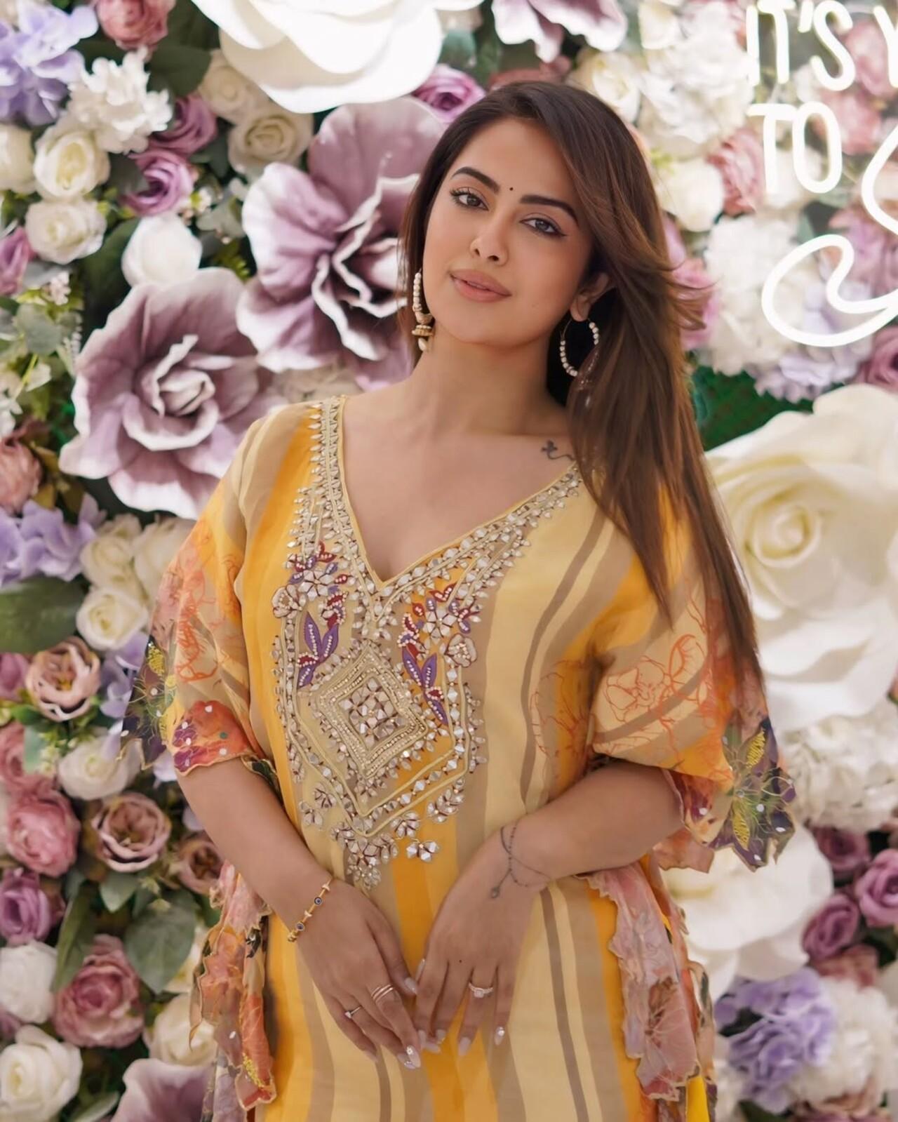 She radiated sunshine in a vibrant yellow kurta, detailed with delicate beadwork and floral sleeves. Light, festive, and joyful, the silhouette reflects her natural grace and everyday elegance