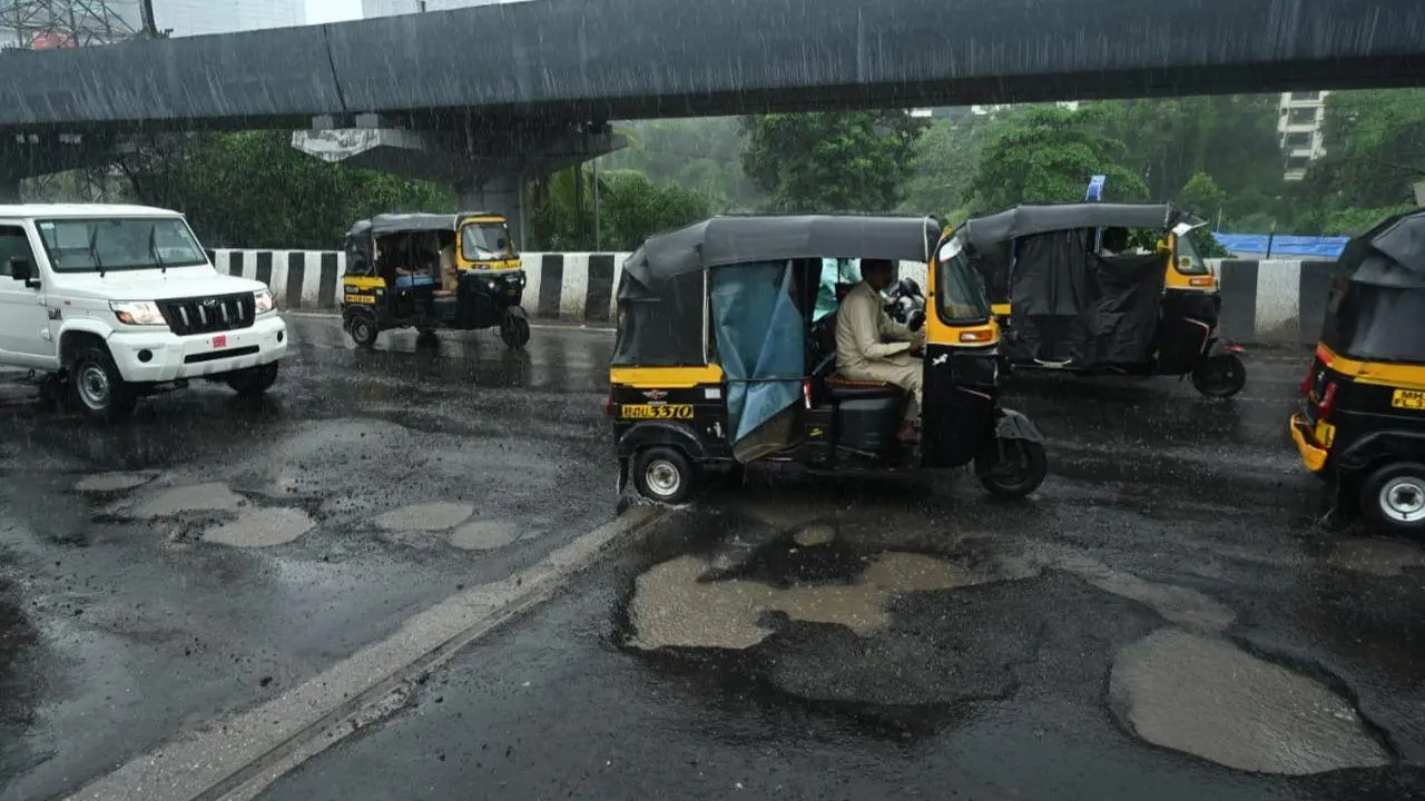 IN PHOTOS: Potholes appear on Dattapada flyover, commuters face rough ride