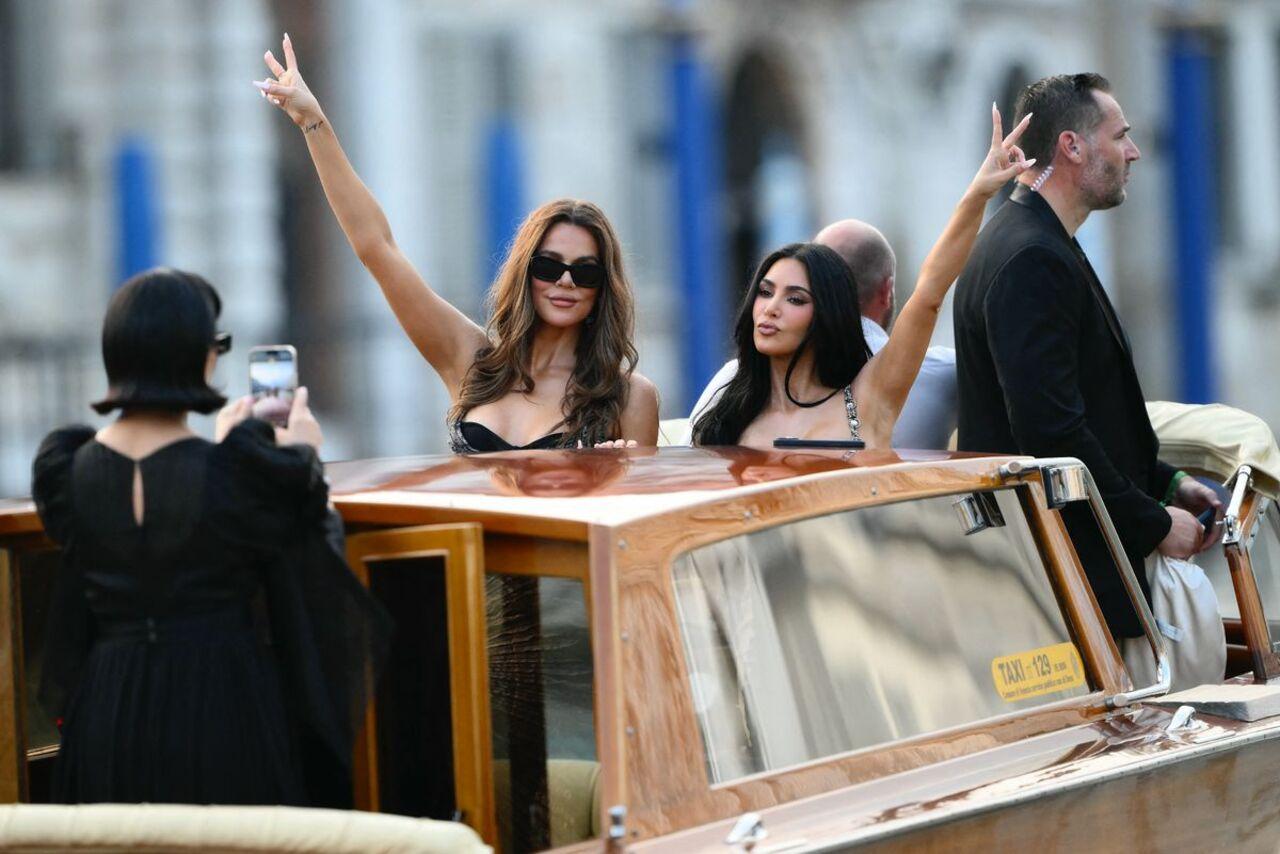 Khloe and Kim Kardashian
Khloé and Kourtney Kardashian brought high-glam energy, posing playfully during the boat ride to Jeff Bezos’s luxurious wedding party, while Kris Jenner played momager behind the lens, capturing the moment like a true pro