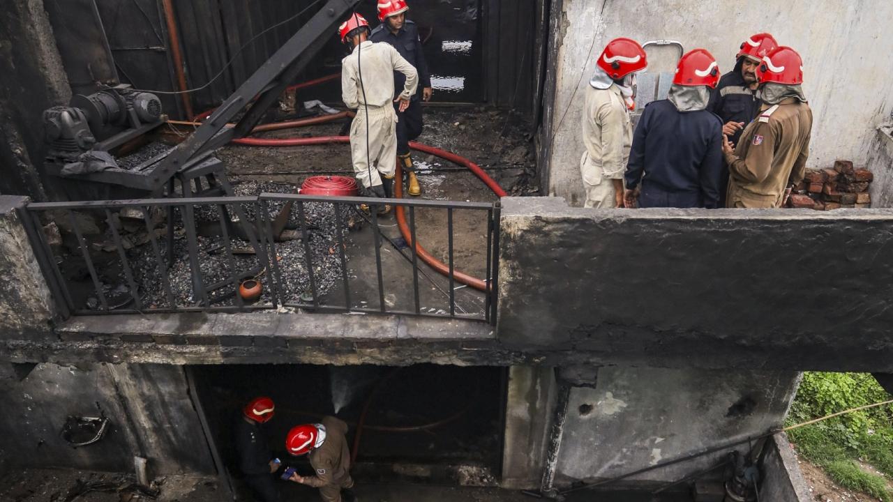 Firefighting team at the site after a fire broke out in a chemical factory, at Rithala, in New Delhi, Wednesday. Pics/PTI