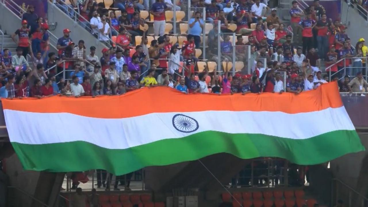A group of fans in the stadium showed up waving a huge Indian flag from the stands (Pic: X)