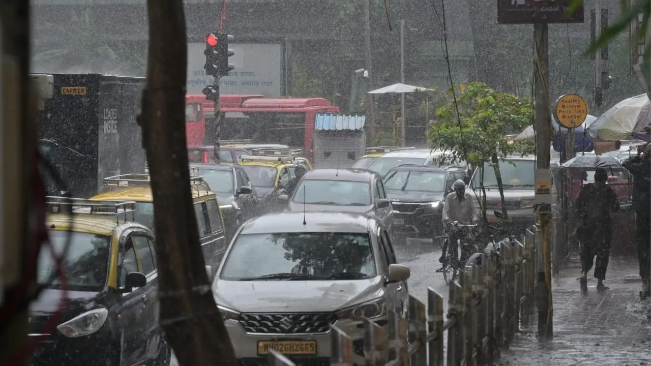 IN PHOTOS: Rains lash parts of Mumbai as IMD predicts light to moderate showers