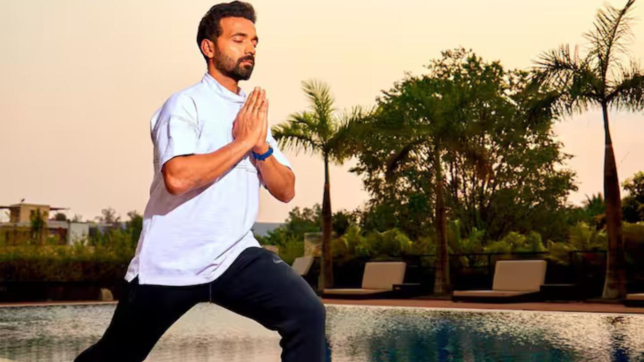 Ajinkya Rahane, known for his composure and focus under pressure, is pictured in the Warrior I (Virabhadrasana I) pose