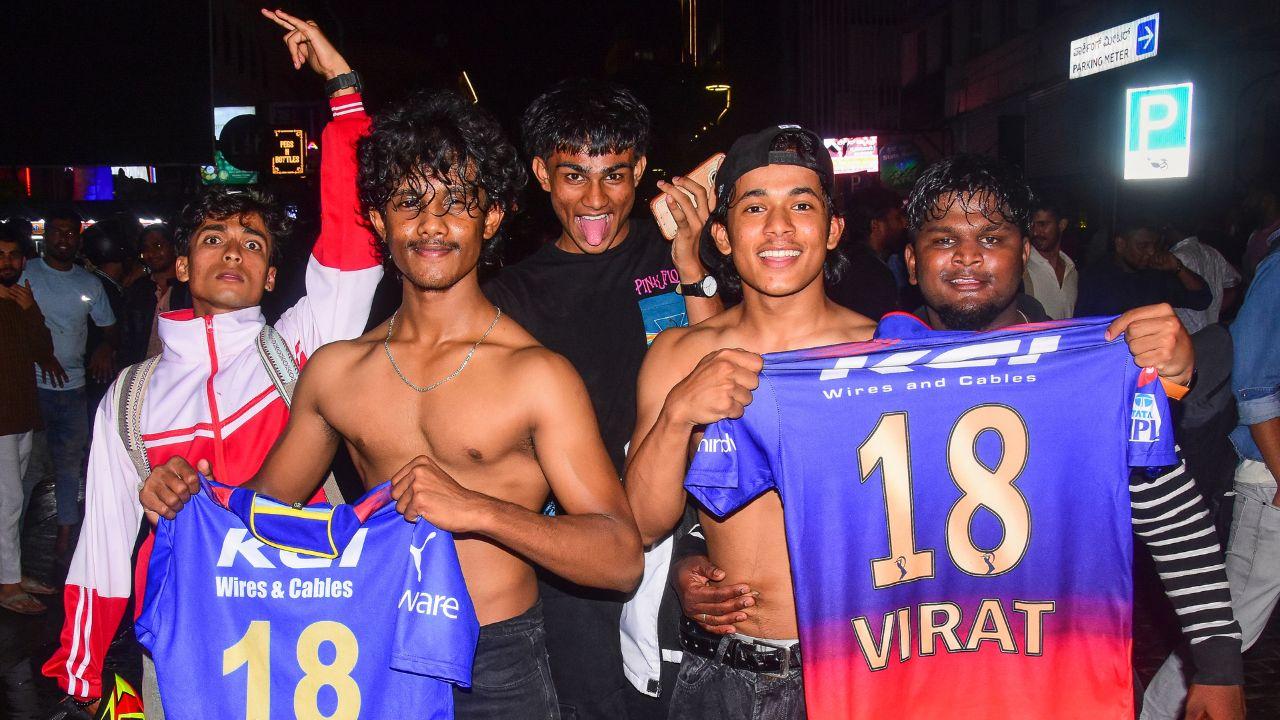 Jubilant scenes unfolded across Bengaluru on Tuesday, June 3, as RCB finally lifted their maiden Indian Premier League (IPL) trophy after a thrilling victory against Punjab Kings in the 2025 T20 final. Pic/ PTI