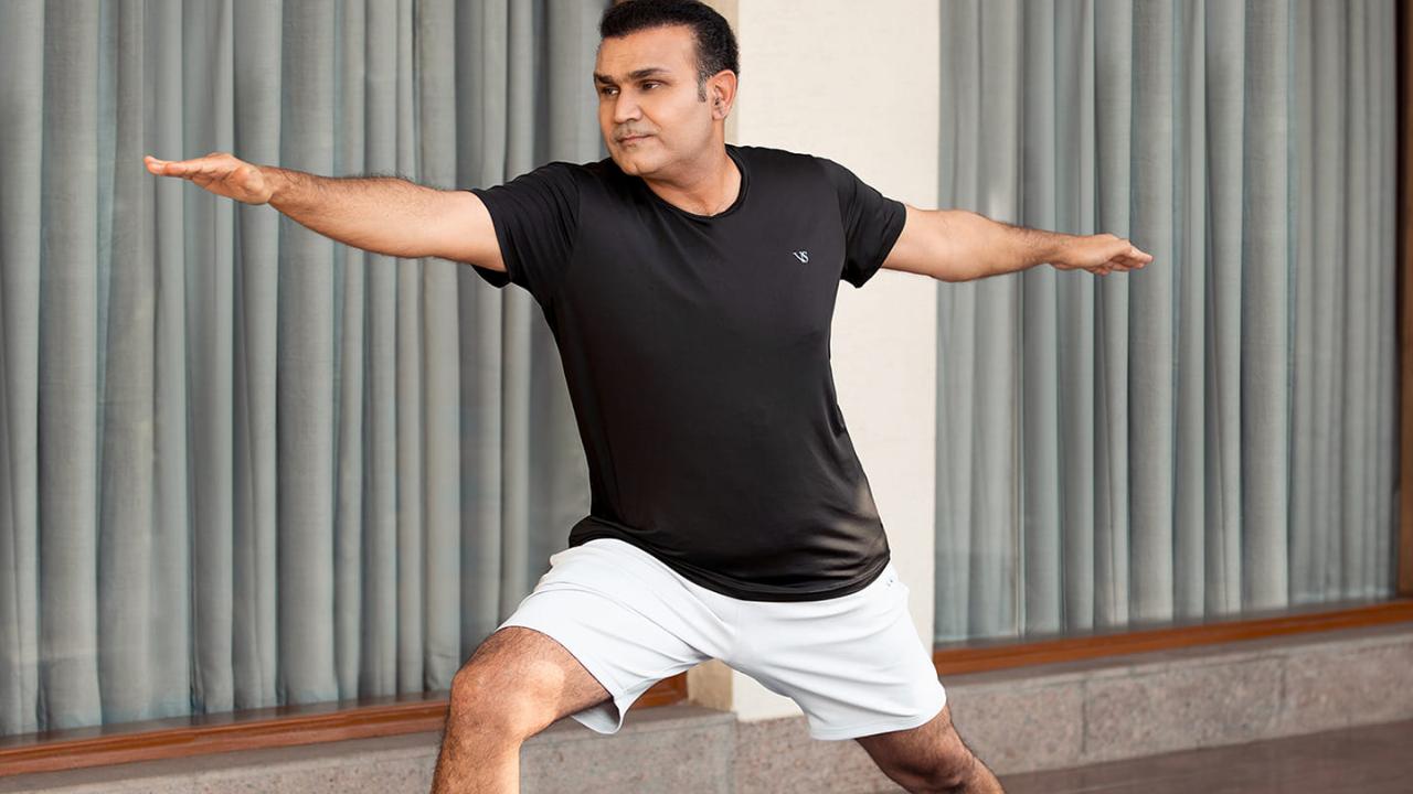 Virender Sehwag, the aggressive and fearless opener, is also seen in the Warrior II pose