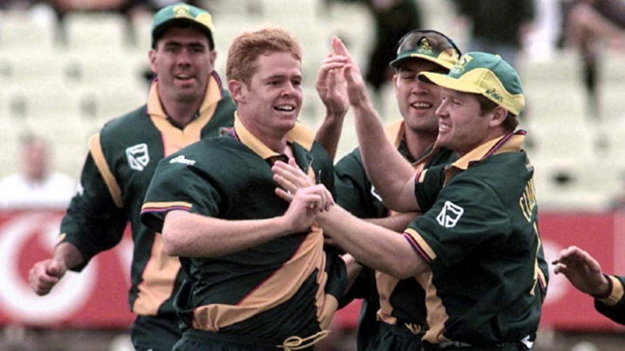1999 World Cup semi-final vs Australia
Chasing 214, South Africa were rescued from the brink by a rampaging Lance Klusener. With nine required off the final over and just one wicket in hand, he hammered two boundaries off the first two balls. The scores were level. One run would have taken them to their first World Cup final, but panic set in. Klusener took off for a single, Donald didn’t. Chaos ensued. The stumps were broken, the match was tied, and Australia progressed on net run rate.
Photo: South Africa's Shaun Pollock is congratulated by teammates after getting the wicket of Australia's Mark Waugh in the first over during 1999 Cricket World Cup semi final