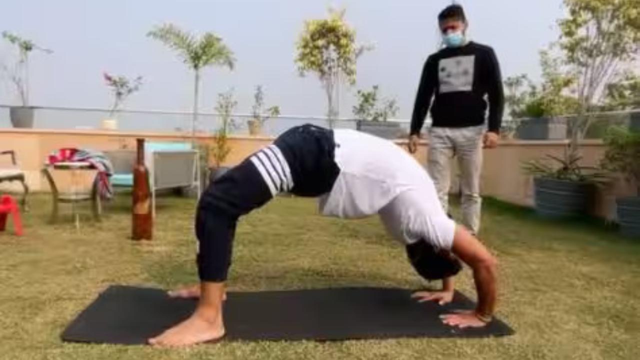 Suresh Raina, one of India’s most agile fielders and dependable middle-order batsmen, is seen executing the Chakrasana or Wheel Pose