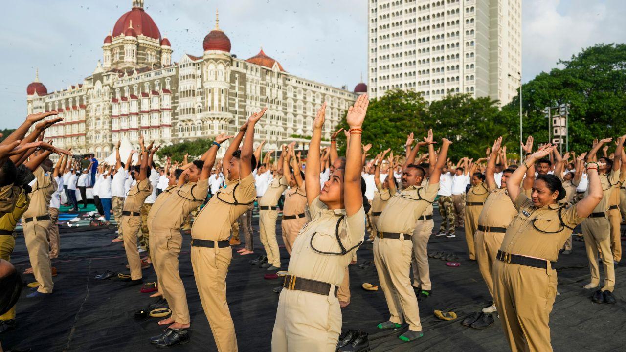 Mumbai Police strike a pose during a yoga session in the city