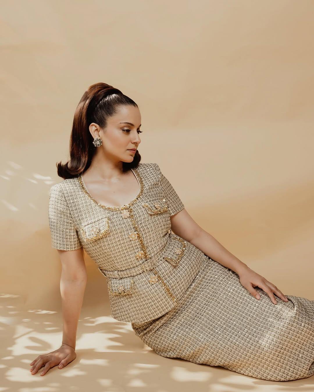 In this look, the actress wore a stunning top that featured multiple pocket designs, golden embroidery, and buttons, and paired it with a straight-fit matching checkered long skirt