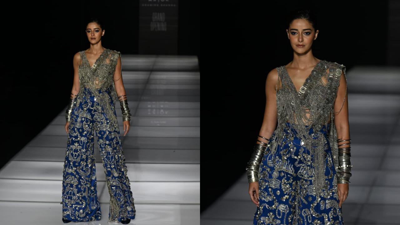 Ananya Panday turned showstopper for Anamika Khanna, donning a dazzling blue and silver outfit. The blue palazzo pants featured silver embellishments and round cuts on the side, while the blouse was covered with silver chains. The ensemble also included a chained pallu, presenting a fresh take on the saree. (Pic: Satej Shinde)