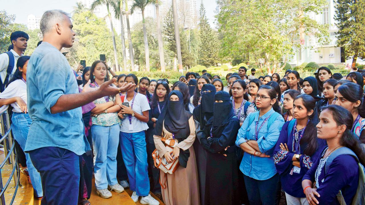 Dr Abhishek Satam (left) guides students through the Zoo