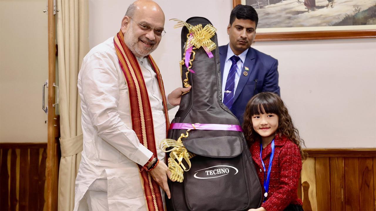 Amit Shah gifts guitar to Mizoram's 7-year-old singing prodigy