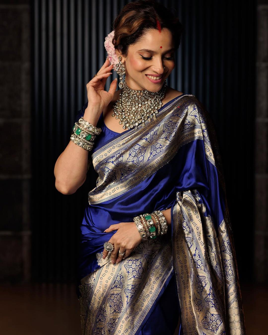 In this look, Ankita paired her beautiful saree with a grand and intricate necklace and big earrings. She further accessorized her appearance with multiple bangles