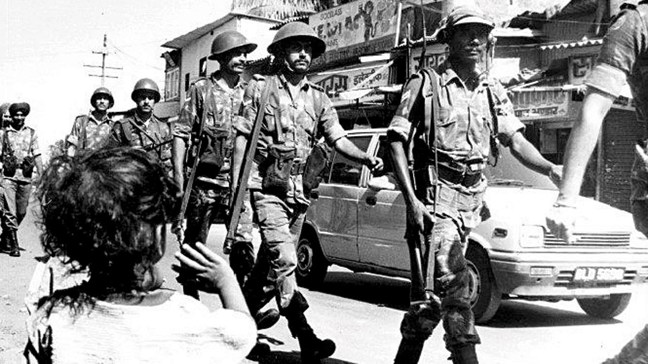 A photograph by Ashesh Shah of mid-day, featured in the exhibition, taken during an army flag march near Worli gaon area
