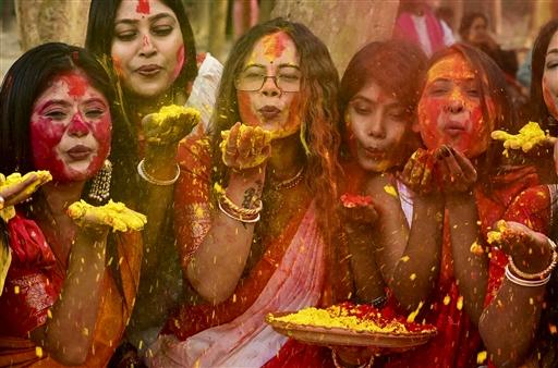 Women celebrate the joy of Holi with 'Gulal' in Balurghat, West Bengal