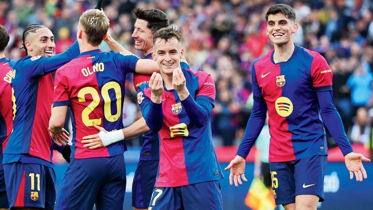 Barca thrash Sociedad 4-0 to go atop La Liga
