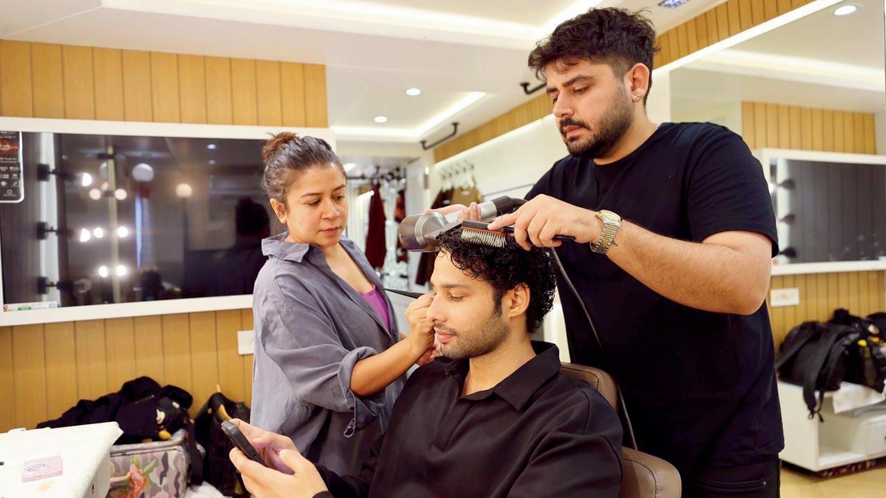 Hinal Dattani giving a touch-up to Sidhant Chaturvedi
