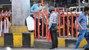Pedestrians maneuver through newly installed grille dividers in Borivali