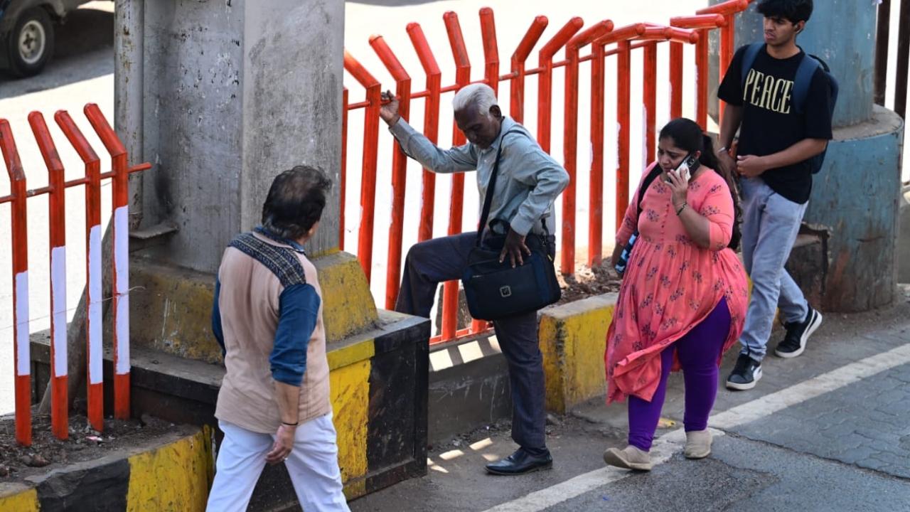 The authorities are installing the barricades to stop pedestrians from crossing the road