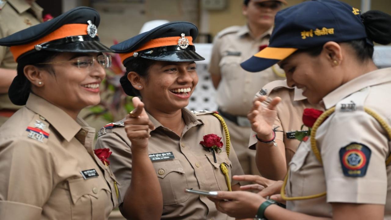 All smiles: The women personnel celebrate the day at Shivaji Park Police Station 