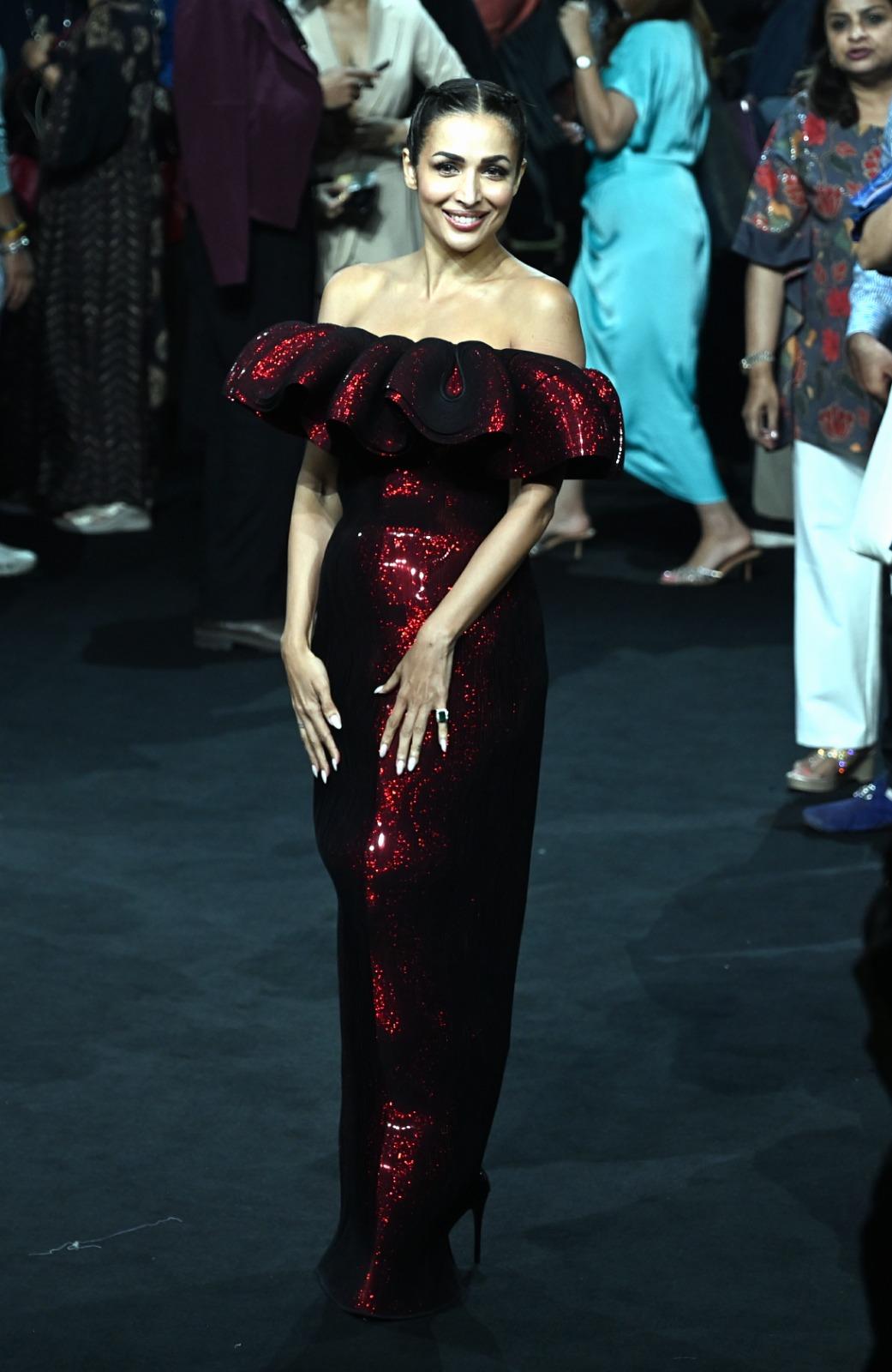 Malaika Arora stunned in a breathtaking red off-shoulder sequin creation by designer Amit Aggarwal as she walked the ramp at Lakmé Fashion Week 2025.