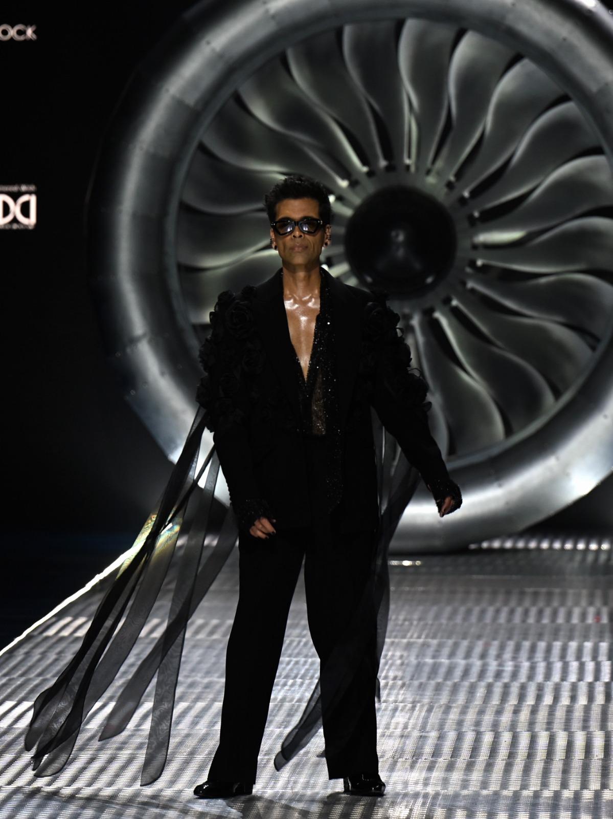 Filmmaker Karan Johar stole the show in his stunning outfit as he turned showstopper for the famous designer duo Falguni Shane Peacock at Lakme Fashion Week in partnership with FDCI.