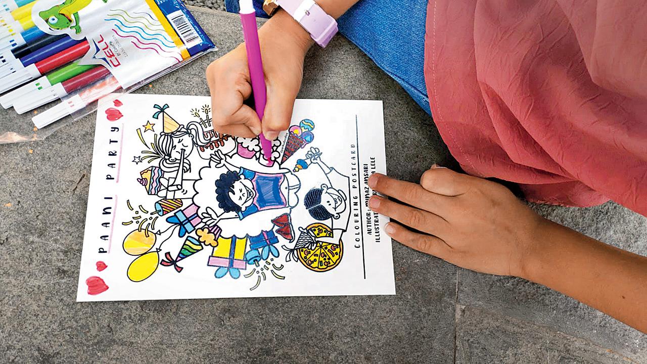 Children colour sheets during a previous workshop. Pic courtesy/Minaz Ansari