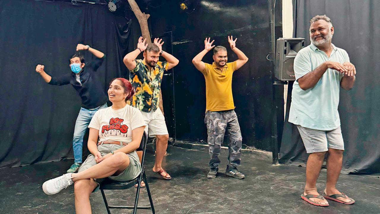 Members of the collective engage in an improv game titled Excuses,  a charades-inspired group activity with an underlying storyline 