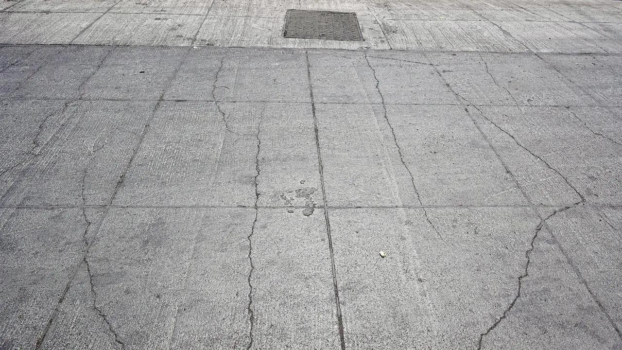 The cement concrete (CC) road near DN Nagar in Andheri West and another in Juhu have developed cracks. Pics. Anurag Ahire and Ashish Raje