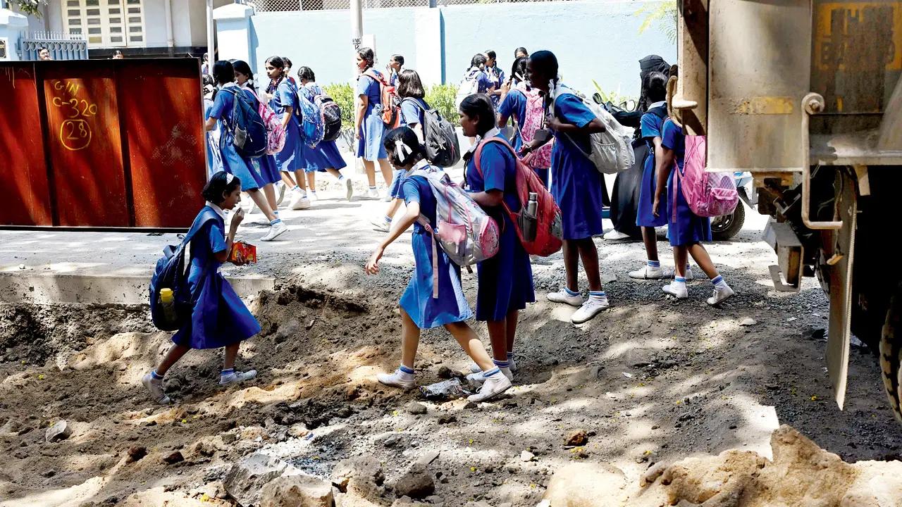 Schoolchildren risk injury while walking on Mia Mohd Chhotani Road, Mahim West. Pic/Ashish Raje