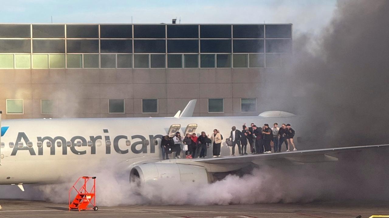 American Airlines plane catches fire at Denver airport gate, passengers evacuated on slides