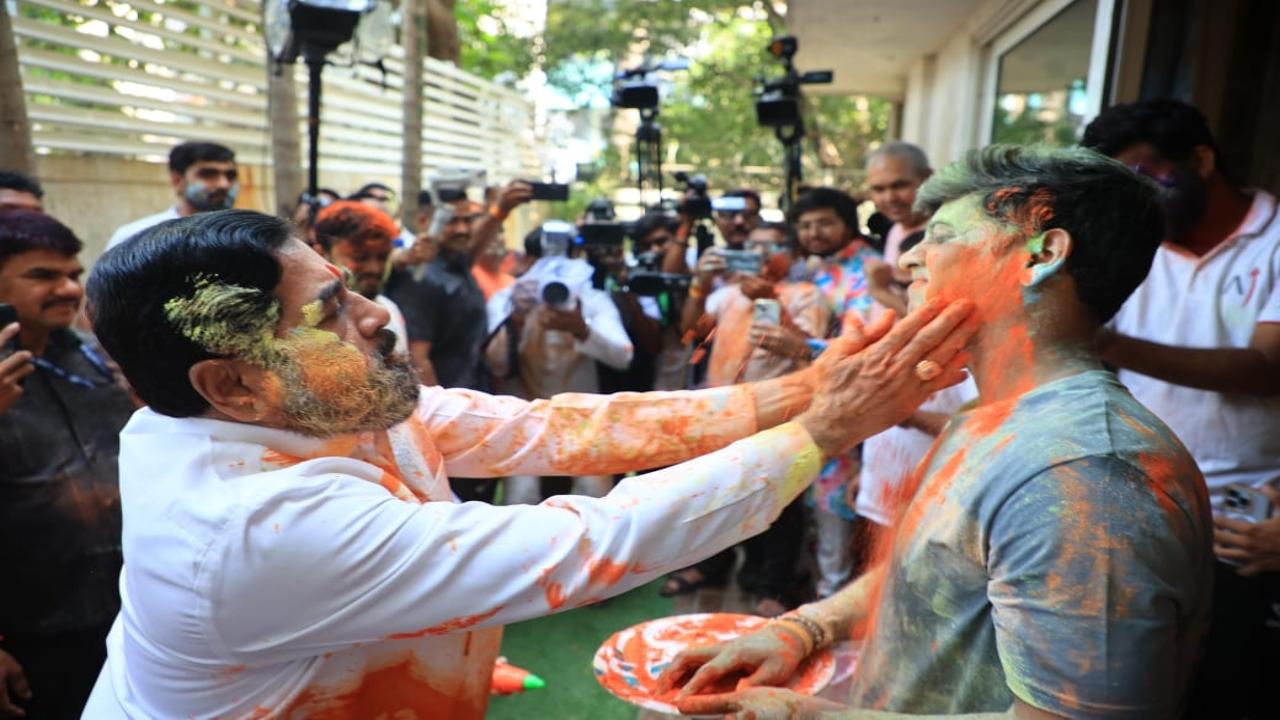 Shinde with son, Dr Shrikant, who is a Member of Parliament in the Lok Sabha from Kalyan