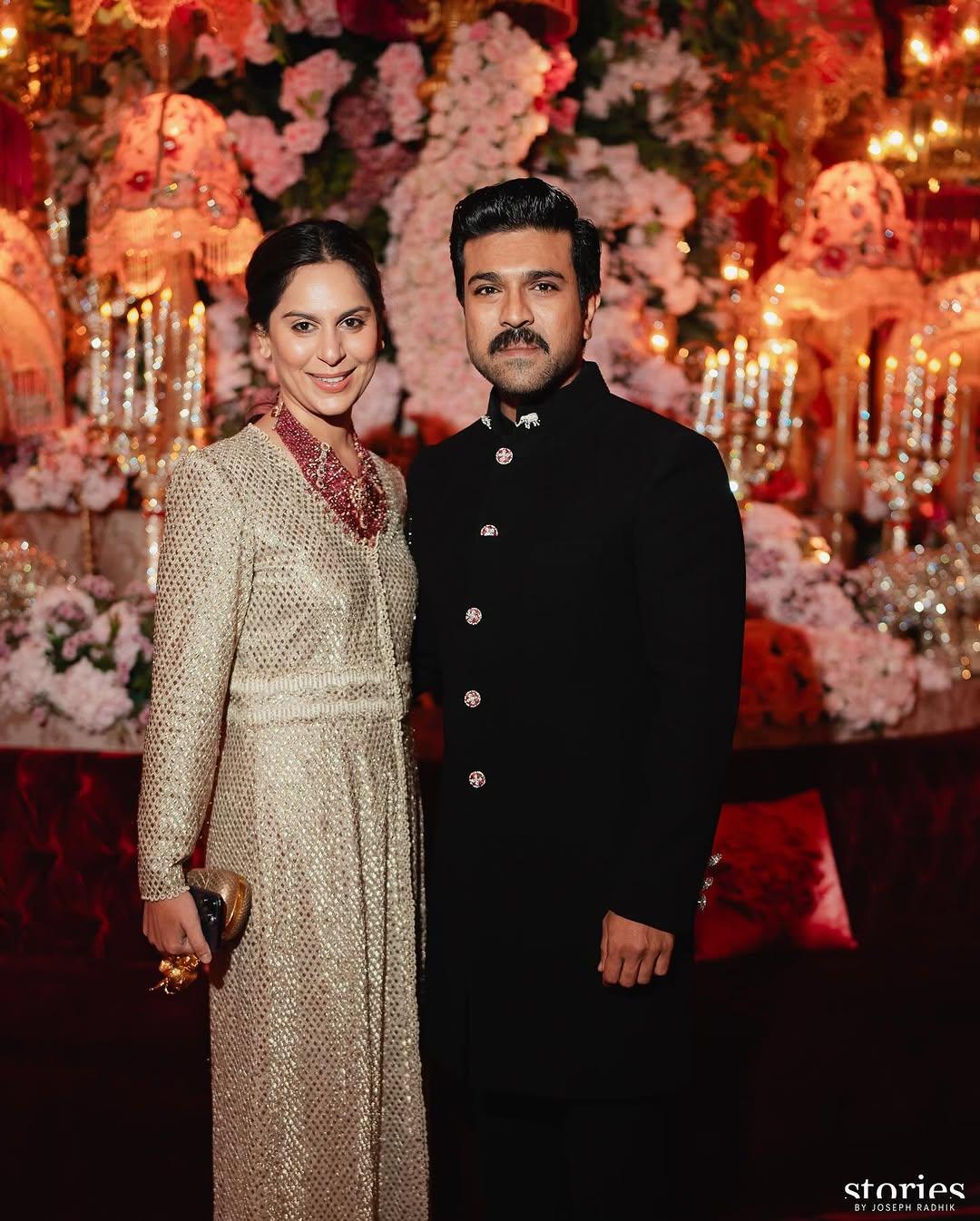 Couple goals! This picture is from Anant Ambani and Radhika Merchant's wedding ceremony. It features Upasana Kamineni posing with Ram Charan