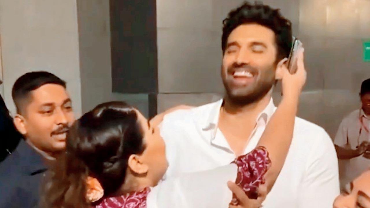 Aditya Roy Kapur tries to be polite while an overenthusiastic fan tries to kiss him