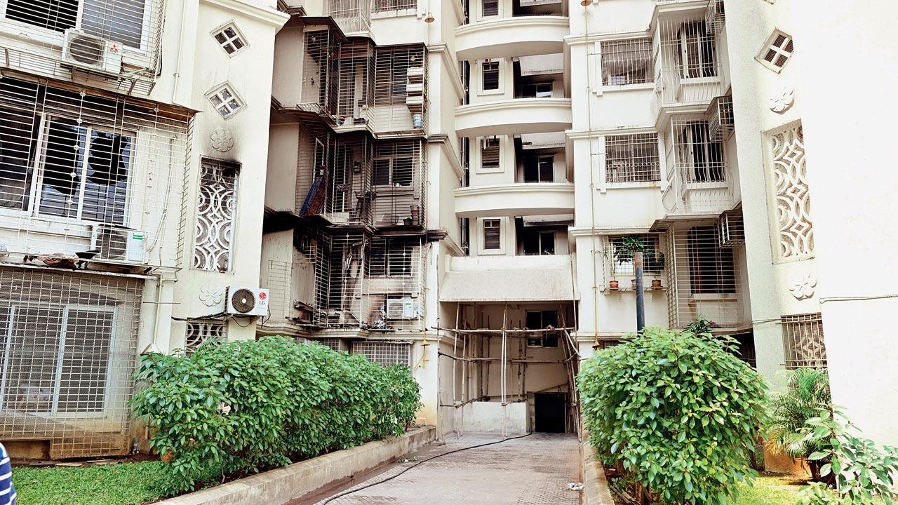 Completely charred apartment in Vidyavihar where the security guard lost his life trying to douse the fire. Pics/Shadab Khan