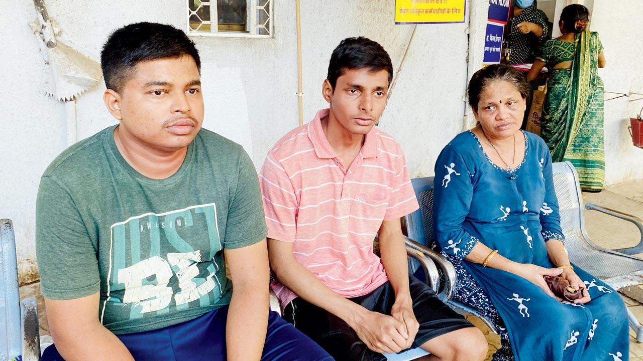 (From left) Prasad Uday Gangan and Vishal Uday Gangan, sons of Uday Gangan, with their mother Ujwala Uday Gangan, at Rajawadi Hospital 