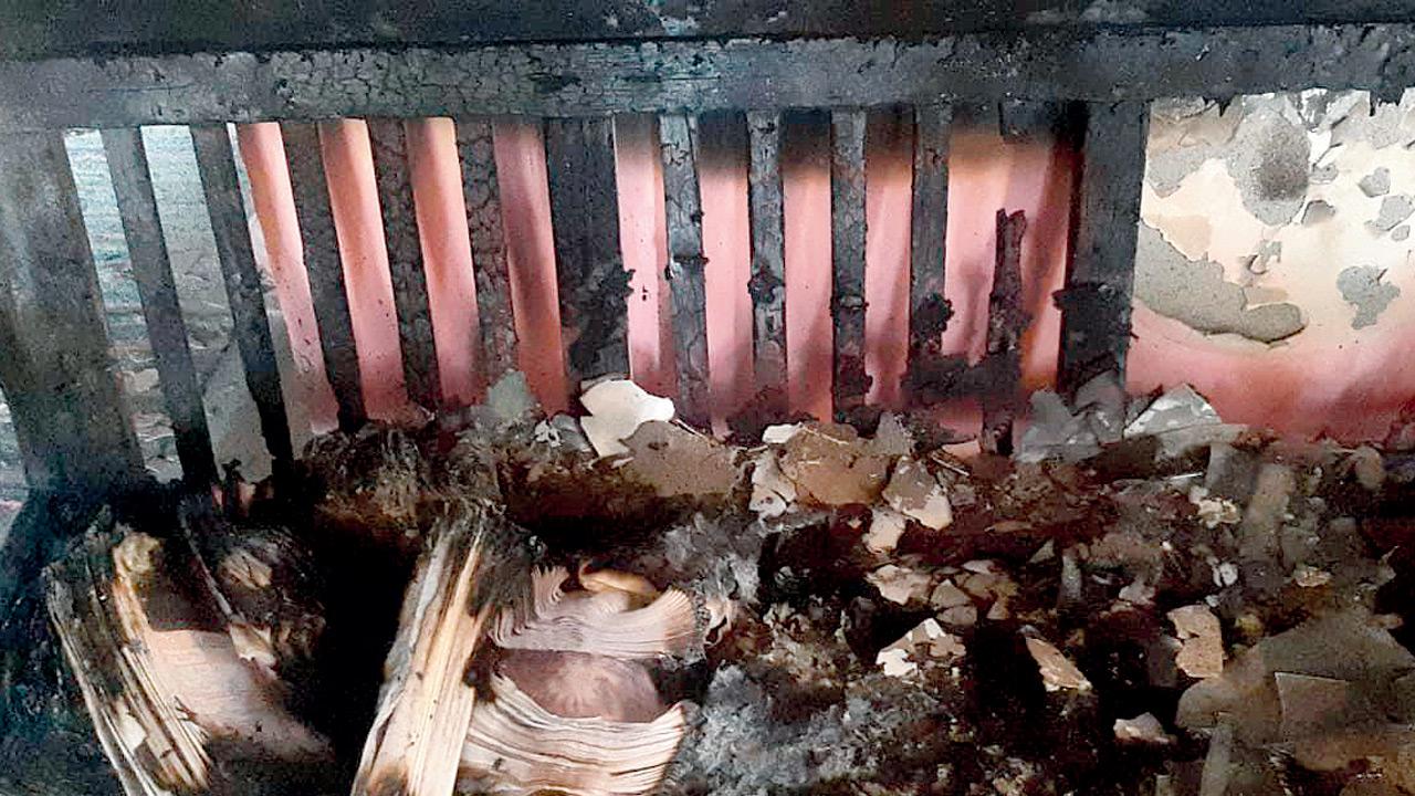 Completely charred sofa and answer sheets taken home by the teacher. Pics/Hanif Patel