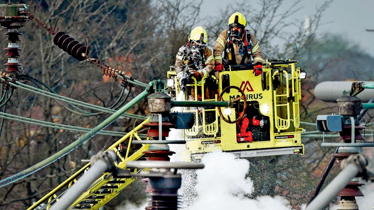 Firefighters douse the fire that broke out on Thursday