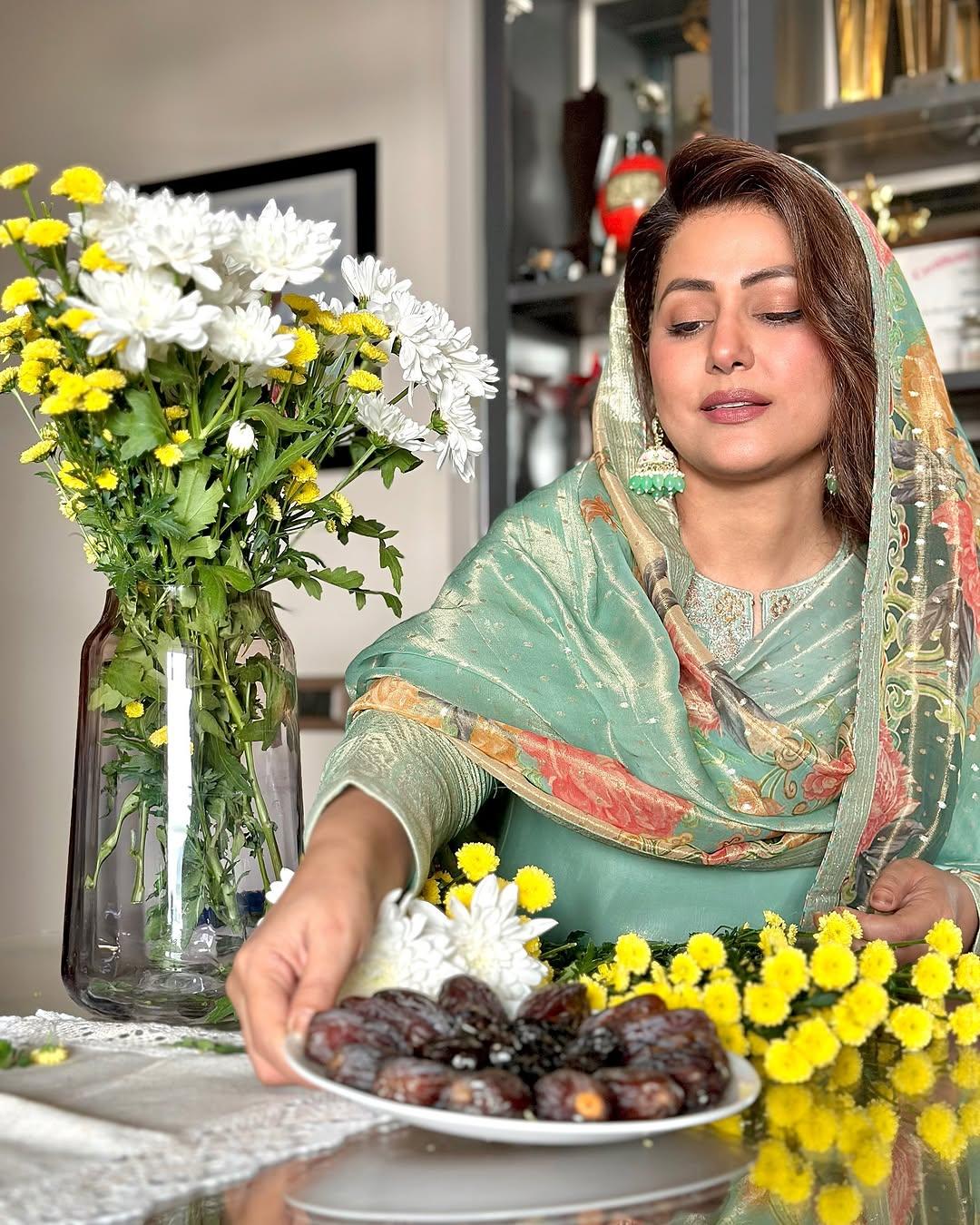 This light green-colored kurta with silver embroidery around the neck gives a cool and comfy vibe. The actress paired the kurta with a shiny green dupatta featuring floral prints.