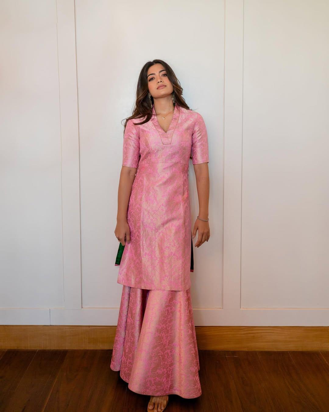 Rashmika embraced effortless elegance in a blush pink brocade kurta set adorned with peacock and floral motifs